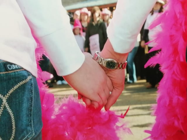 A very important photo - two people holding hands at one of our walks - very significant as we have always said: "It's not all about money - it's the people who are more important."