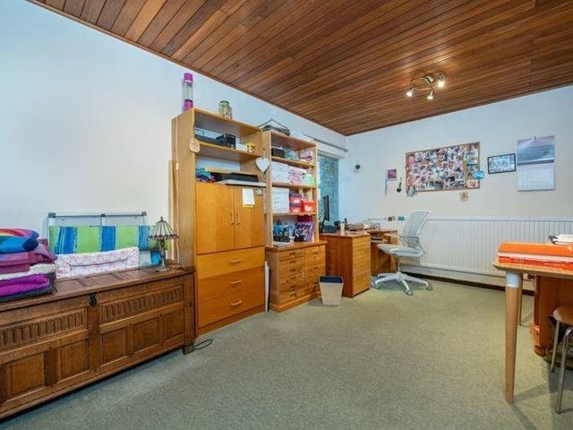 One of the other bedrooms, here also doubling as an office.