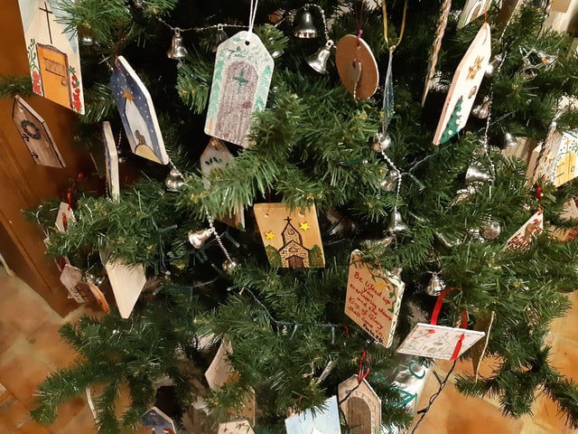 The Friends of St John the Baptist Church Findon are raising money to repair the church door, so took the theme of doors for their Christmas Tree