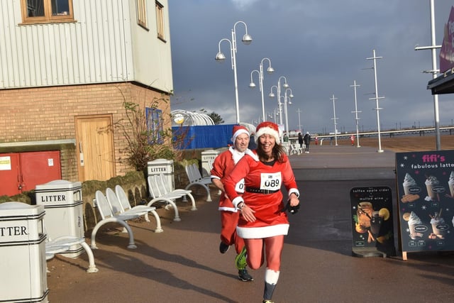 Halfway round and still smiling in the Skegness Santa Run.