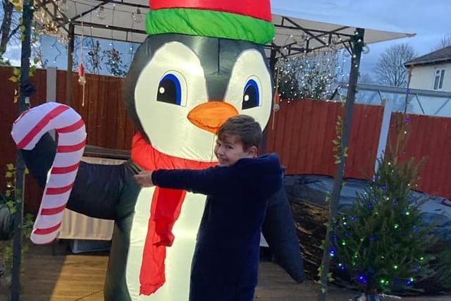 Vicki Bisgrove Wilson sent us this photo of Kyle meeting a rather festive friend. Bonus points for the little tree just to the right.