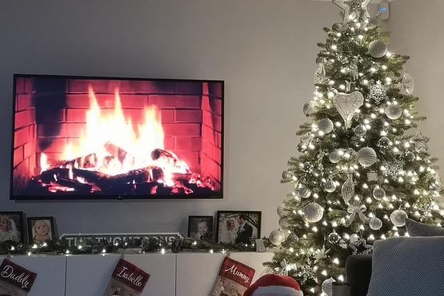 Jenny Thompson brought the festive atmosphere of a crackling fire into the 21st century here with the clever use of a Youtube video. A special mention goes to the silver theme of the tree, which complements the contemporary style of the room very well. A sterling effort.