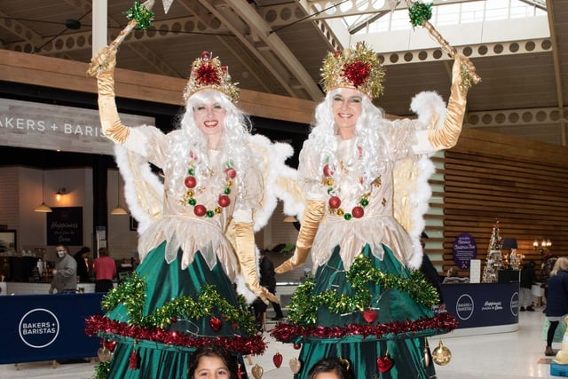 Youngsters joined walkabouts courtesy of glamorous stilt walking Christmas tree fairies