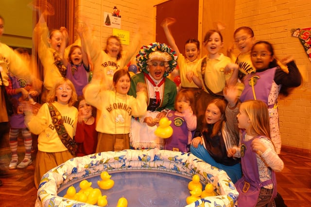 Key theatre panto star Mrs Gepetto opens the 1st Millfield brownies xmas bazaar. pictured fishing with rainbow member Hannah, 5, and friends.