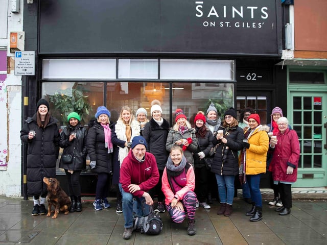 Founder of 'Northamptonshire Walks', Dave Askew, gives a tour of Northampton's shoe factory district to the fortnightly Women's Wellness Walks hosted by Saints Coffee and granola business owner, Salma Shah. Sunday, December 5 2021. Photo by Kirsty Edmonds.