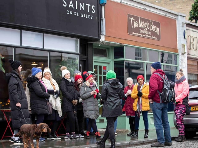 Founder of 'Northamptonshire Walks', Dave Askew, gives a tour of Northampton's shoe factory district to the fortnightly Women's Wellness Walks hosted by Saints Coffee and granola business owner, Salma Shah. Sunday, December 5 2021. Photo by Kirsty Edmonds.