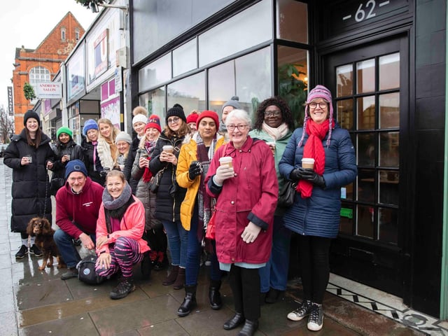 Founder of 'Northamptonshire Walks', Dave Askew, gives a tour of Northampton's shoe factory district to the fortnightly Women's Wellness Walks hosted by Saints Coffee and granola business owner, Salma Shah. Sunday, December 5 2021. Photo by Kirsty Edmonds.