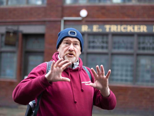 Founder of 'Northamptonshire Walks', Dave Askew, gives a tour of Northampton's shoe factory district to the fortnightly Women's Wellness Walks hosted by Saints Coffee and granola business owner, Salma Shah. Sunday, December 5 2021. Photo by Kirsty Edmonds.
