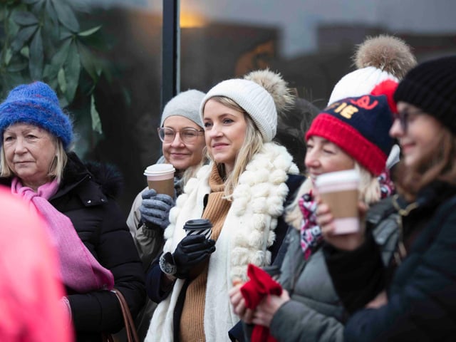 Founder of 'Northamptonshire Walks', Dave Askew, gives a tour of Northampton's shoe factory district to the fortnightly Women's Wellness Walks hosted by Saints Coffee and granola business owner, Salma Shah. Sunday, December 5 2021. Photo by Kirsty Edmonds.