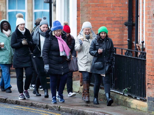 Founder of 'Northamptonshire Walks', Dave Askew, gives a tour of Northampton's shoe factory district to the fortnightly Women's Wellness Walks hosted by Saints Coffee and granola business owner, Salma Shah. Sunday, December 5 2021. Photo by Kirsty Edmonds.