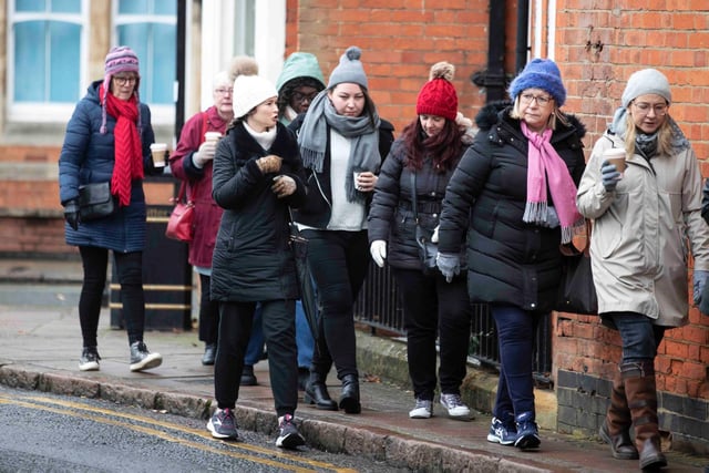 Founder of 'Northamptonshire Walks', Dave Askew, gives a tour of Northampton's shoe factory district to the fortnightly Women's Wellness Walks hosted by Saints Coffee and granola business owner, Salma Shah. Sunday, December 5 2021. Photo by Kirsty Edmonds.