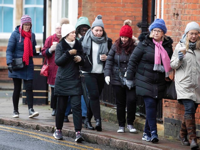 Founder of 'Northamptonshire Walks', Dave Askew, gives a tour of Northampton's shoe factory district to the fortnightly Women's Wellness Walks hosted by Saints Coffee and granola business owner, Salma Shah. Sunday, December 5 2021. Photo by Kirsty Edmonds.