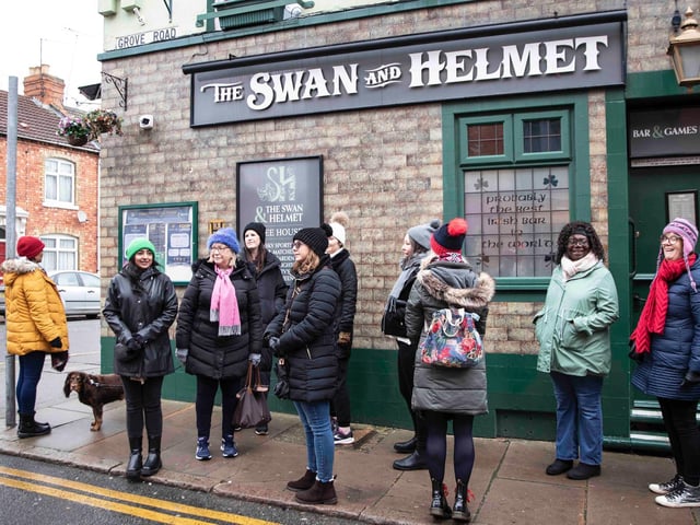 Founder of 'Northamptonshire Walks', Dave Askew, gives a tour of Northampton's shoe factory district to the fortnightly Women's Wellness Walks hosted by Saints Coffee and granola business owner, Salma Shah. Sunday, December 5 2021. Photo by Kirsty Edmonds.