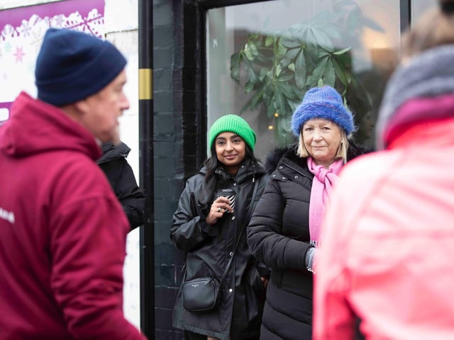 Founder of 'Northamptonshire Walks', Dave Askew, gives a tour of Northampton's shoe factory district to the fortnightly Women's Wellness Walks hosted by Saints Coffee and granola business owner, Salma Shah. Sunday, December 5 2021. Photo by Kirsty Edmonds.