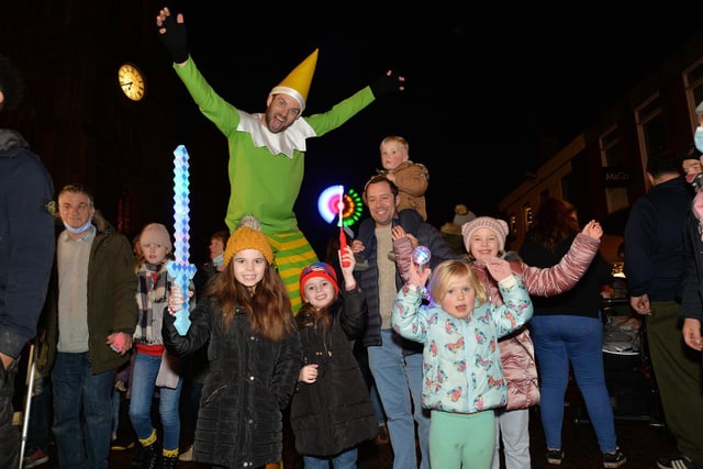 Elf on stilts entertains shoppers during the Christmas Fair.