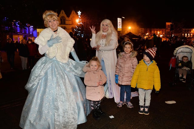 Cinderella and Elsa greet children during the Christmas Fair.