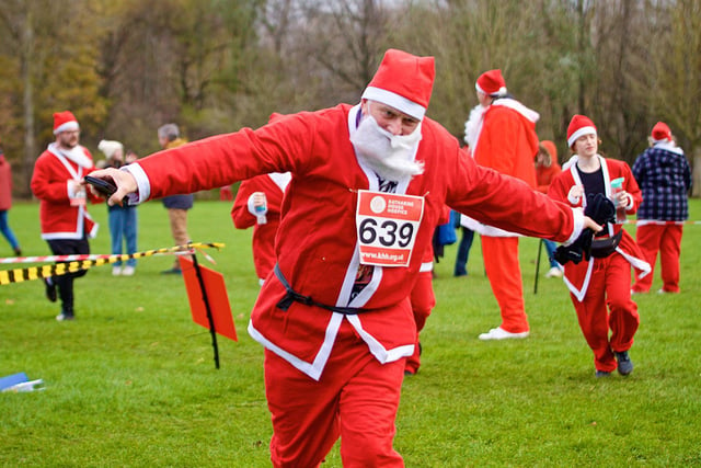 A runner nears the finish line at the 5K Santa Fun Run to benefit Katharine House Hospice at Spiceball Park in Banbury on Sunday December 5 (Image from David Fawbert photography)
