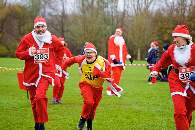 Runners approach the finish line of the Santa Fun Run to benefit Katharine House Hospice at Spiceball Park in Banbury on Sunday December 5 (Image from David Fawbert photography)