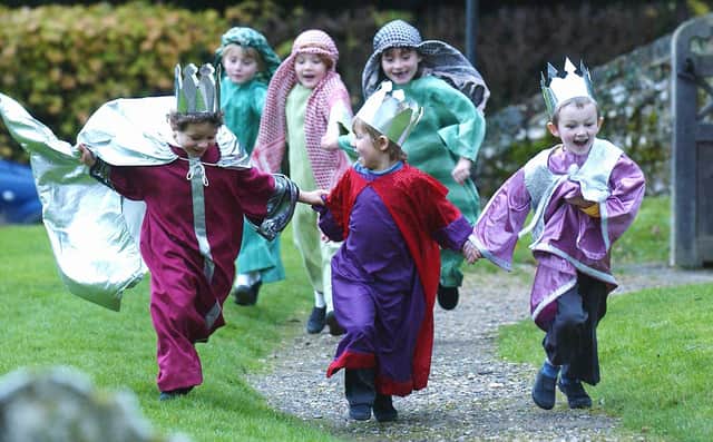 Children from Graffham Infant School running to their church Nativity play in 2006. Picture: Louise Adams