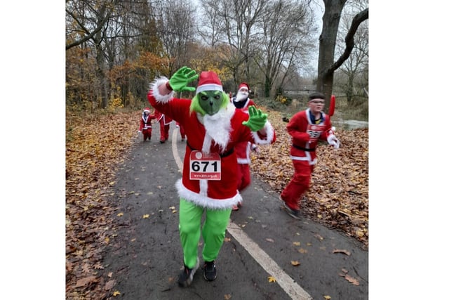 A woman from Oxford attended the Katharine House Hospice Santa Fun Run dressed as the Grinch