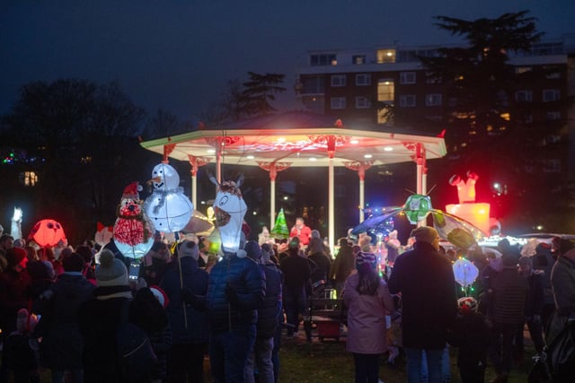 Crowds gather in the Pump Room Gardens at the 2021 Leamington Lantern Parade.