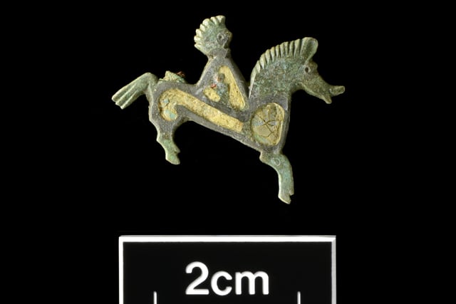 Enamelled copper-alloy horse-and-rider brooch.  Picture: Albion Archaeology & Adam Williams