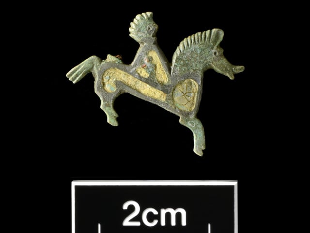 Enamelled copper-alloy horse-and-rider brooch. Picture: Albion Archaeology & Adam Williams