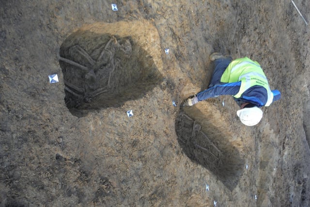Grave of crucified skeleton in background. Picture: -Albion Archaeology