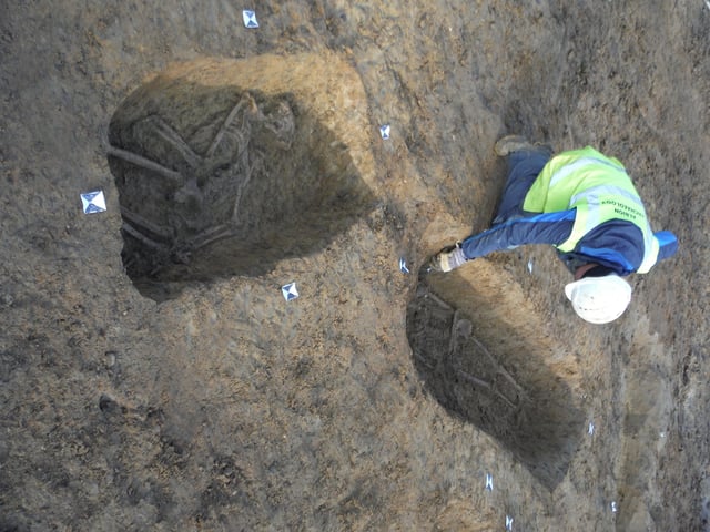 Grave of crucified skeleton in background. Picture: -Albion Archaeology