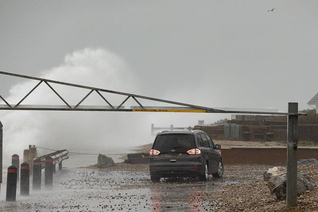 Selsey seasfront gets a lashing from storm 'Barra' as a car gets a close up view of a huge wave hitting the Selsey coast. By Chris Hatton SUS-210812-084452003