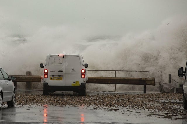 Selsey seasfront gets a lashing from storm 'Barra' as a car and van get up close to the force of nature. By Chris Hatton SUS-210812-084502003