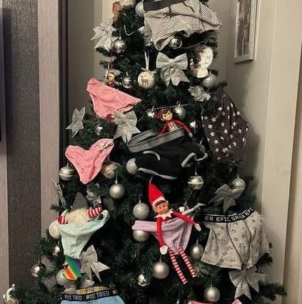 Not satisfied with foil, the elves then decorated the tree with underwear!