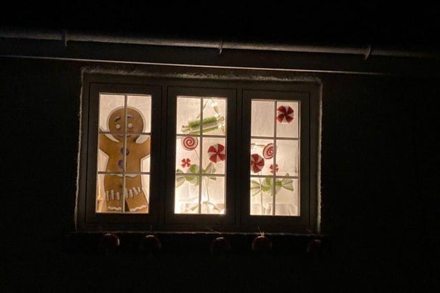 Giant gingerbread man makes appearance in this window