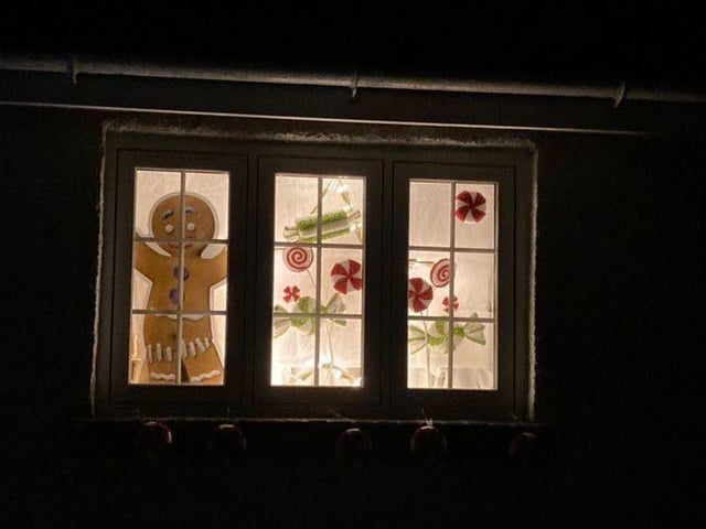Giant gingerbread man makes appearance in this window