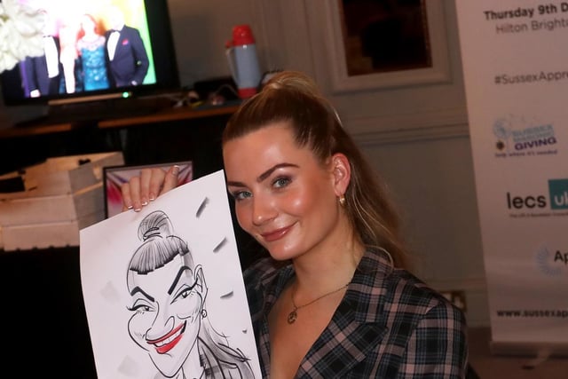 One of the nominees with their caricature.