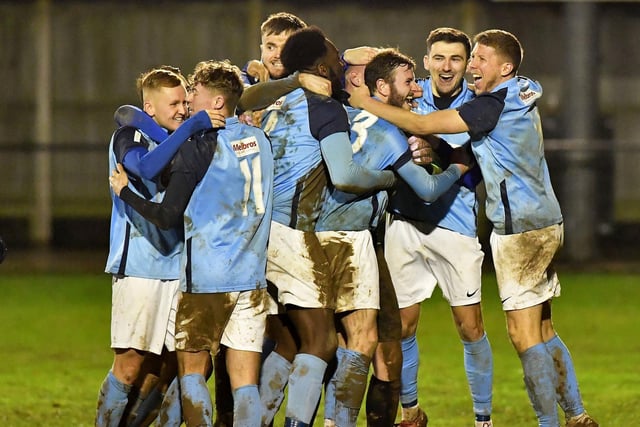Rugby Town celebrate their penalty shoot-out win