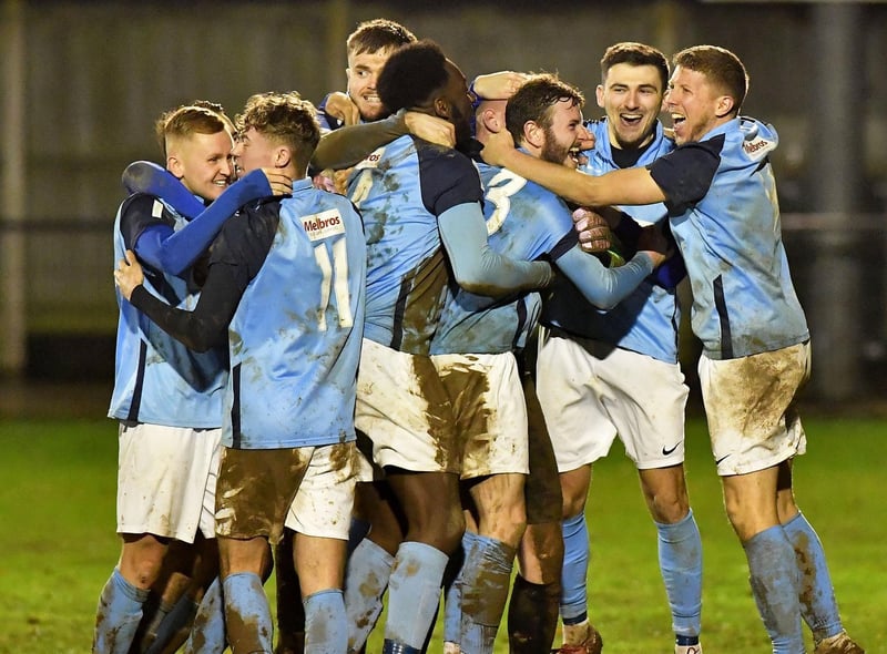 Rugby Town celebrate their penalty shoot-out win