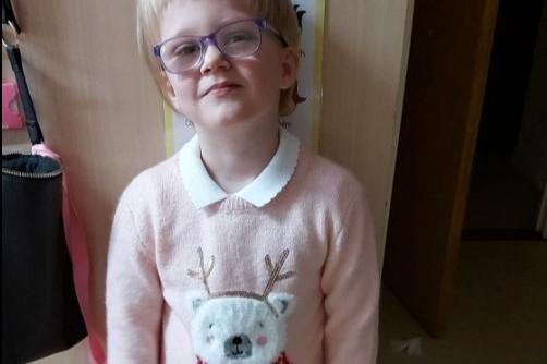Lisa Eagle's daughter wearing a Christmas jumper for school