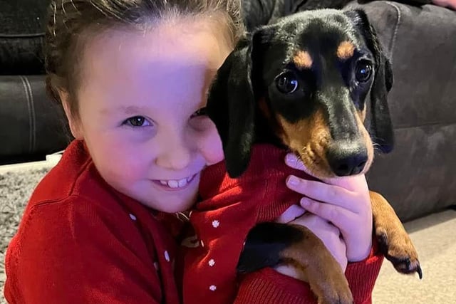 "Our eight month old rescue Daxie, matching jumpers with our daughter," said Michaela Carr SUS-211213-132342001