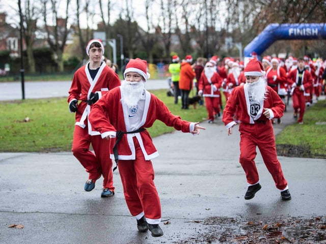 Hundreds of Santas take on a fancy dress fun run at Northampton's Racecourse on Sunday December 12. Photo: Kirsty Edmonds.