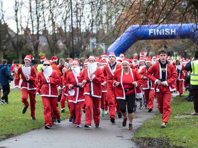 Hundreds of Santas take on a fancy dress fun run at Northampton's Racecourse on Sunday December 12. Photo: Kirsty Edmonds.