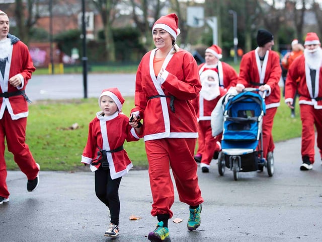 Hundreds of Santas take on a fancy dress fun run at Northampton's Racecourse on Sunday December 12. Photo: Kirsty Edmonds.