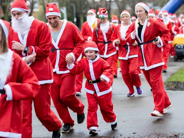 Hundreds of Santas take on a fancy dress fun run at Northampton's Racecourse on Sunday December 12. Photo: Kirsty Edmonds.