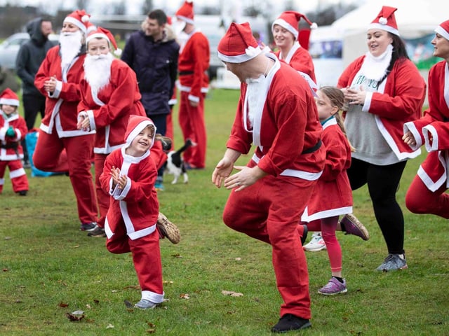 Hundreds of Santas take on a fancy dress fun run at Northampton's Racecourse on Sunday December 12. Photo: Kirsty Edmonds.