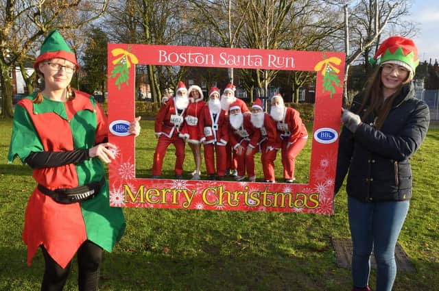 The ‘Elfie Selfie’ proved popular - pictured here framing a group of Santas as they prepare to take part in the run. Photos by David Dawson.