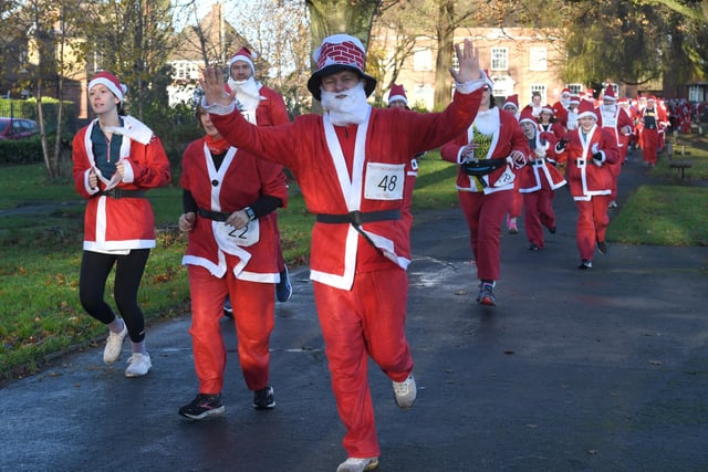 Participants in the annual Boston Santa Run hosted by Boston Community Runners.