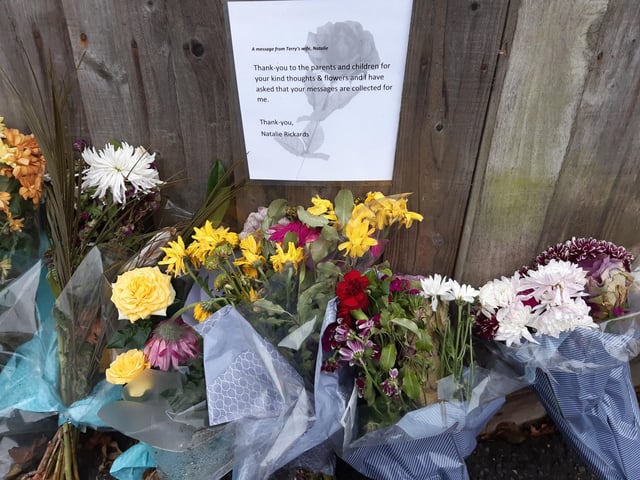 Flowers have been placed in a line to show how much Terry meant to the school, and his widow, Natalie Rickards, left a message of thanks to the parents and children for their kind thoughts