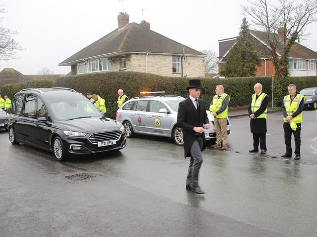 Scores of people lined the street to pay tribute to Worthing lollipop man Terry Rickards as his funeral cortege drove past the spot where he served