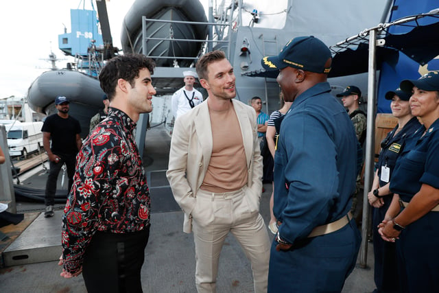HONOLULU, HAWAII - OCTOBER 20: (L-R)  Darren Criss and Ed Skrein speak with sailors aboard the USS Halsey on October 20, 2019 in Honolulu, Hawaii. (Photo by Marco Garcia/Getty Images for Lionsgate Entertainment) 775424021