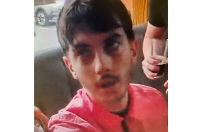 The first suspect is described by police as a white man in his late teens or early 20s, with dark hair and unshaven. He was wearing a pink shirt. Photo from Sussex Police. SUS-211215-175526001